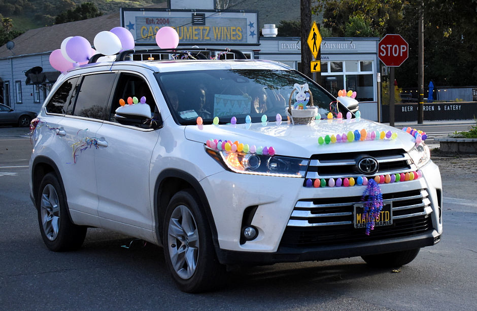 An SUV deocorated in Easter eggs participates in the Cruise Los Alamos Cruise parade Saturday evening.
